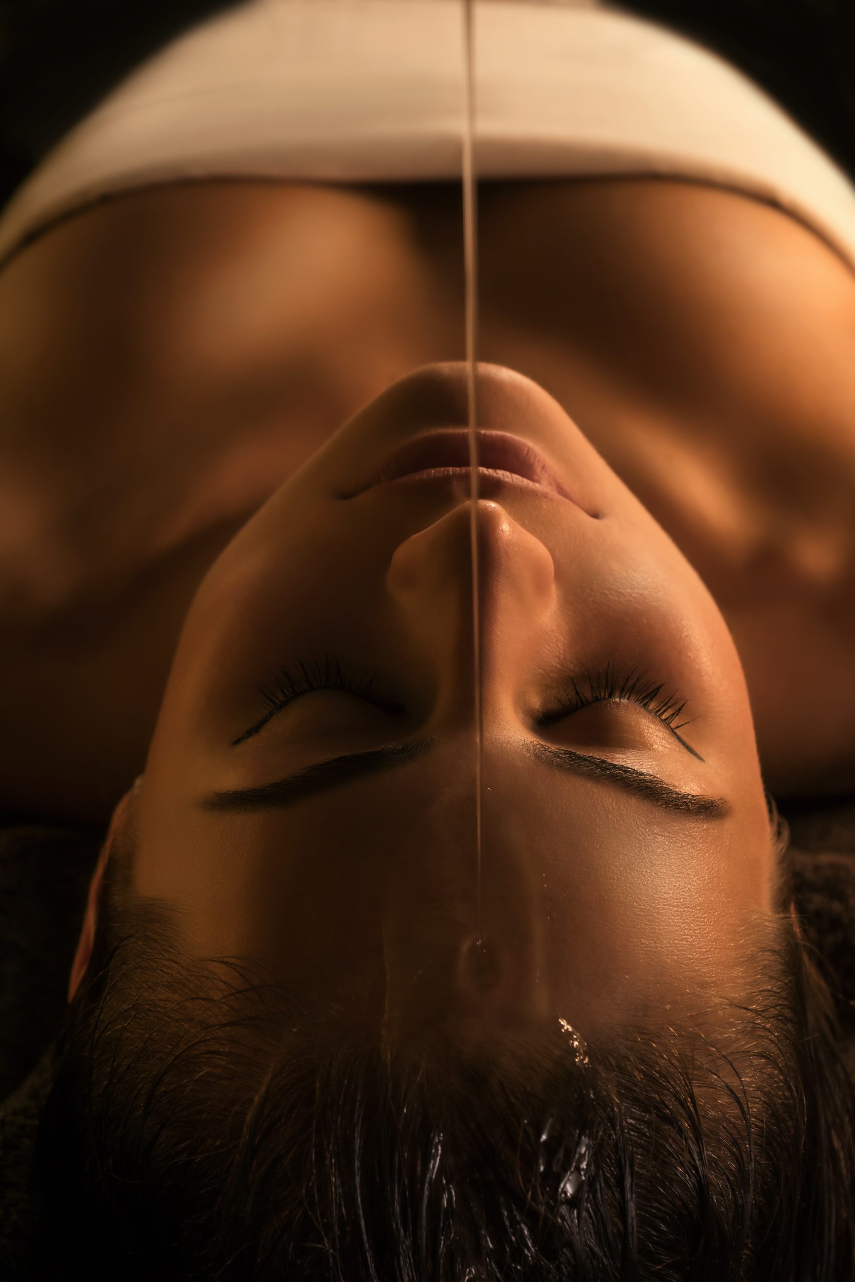 Traditional Ayurvedic Shirodhara vessel used in an Ayurvedic spa ritual