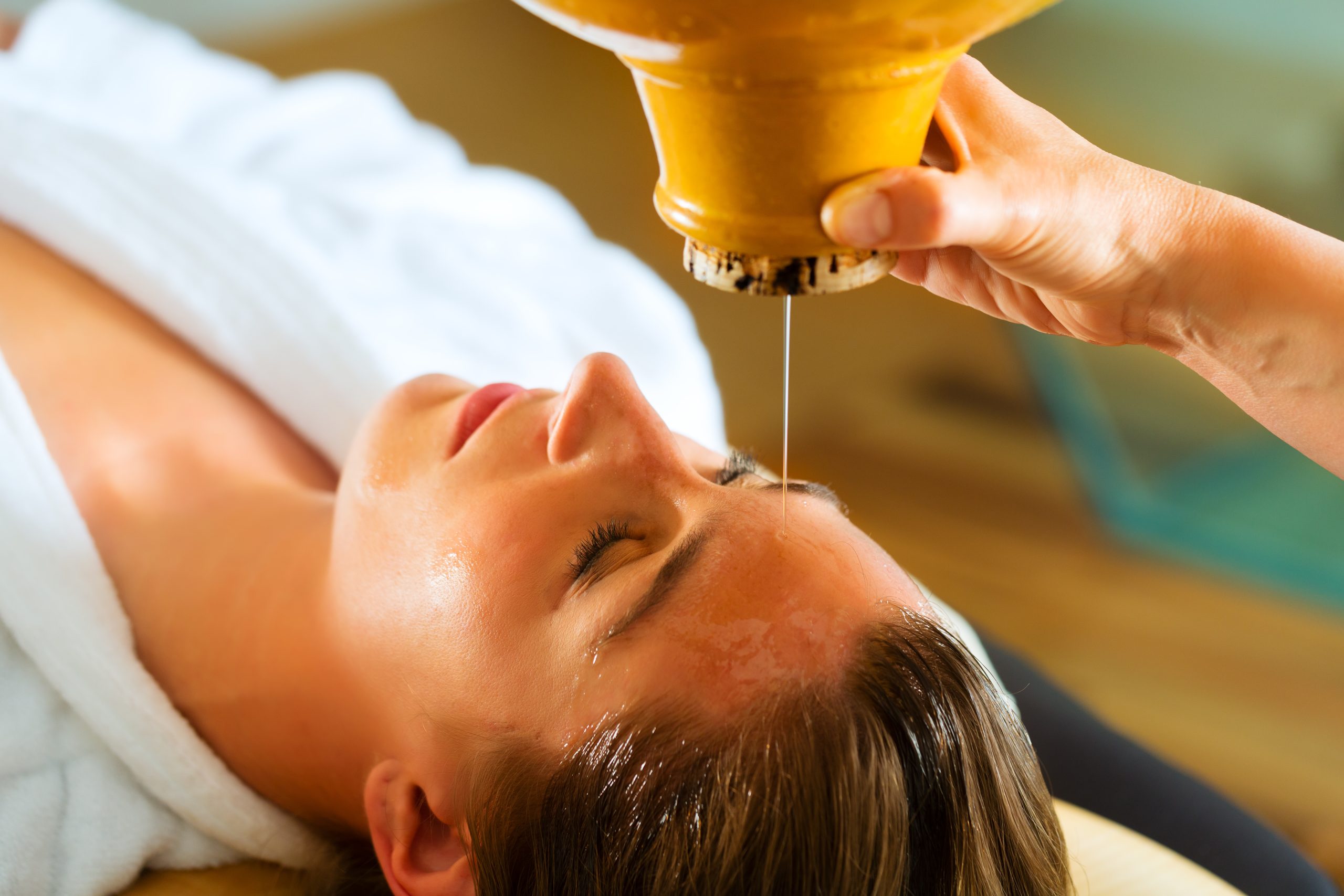 Shirodhara Ayurvedic oil treatment used in the VedaFusion Head Spa experience